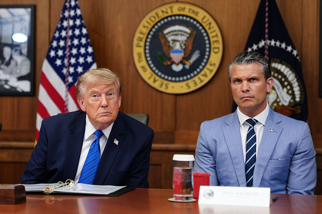 Donald Trump and Pete Hegseth listen to questions from the press during a Cabinet meeting at Camp David in Maryland, on July 31, 2026. 