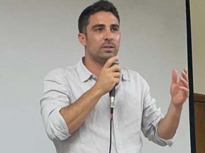 Lorenzo Pacini, primary candidate for the upcoming mayoral election in Milan, Italy, is pictured speaking.