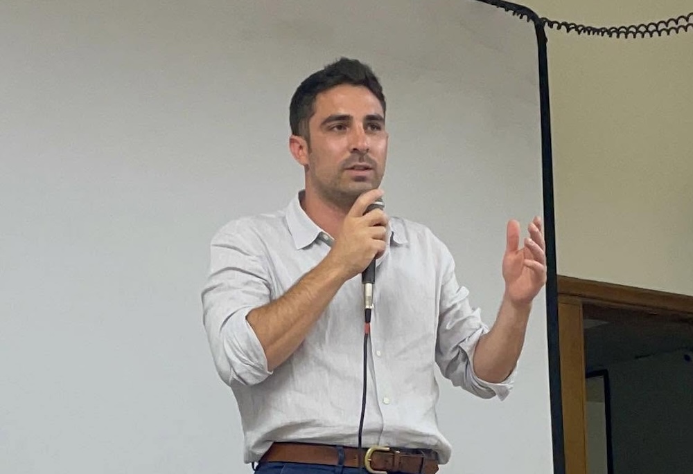 Lorenzo Pacini, primary candidate for the upcoming mayoral election in Milan, Italy, is pictured speaking.