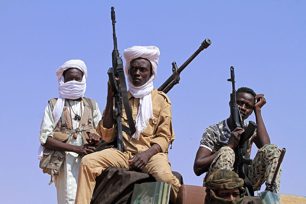 A group of armed defectors from the paramilitary Rapid Support Forces (RSF) arrive in vehicles as they are believed to be surrendering to the Sudanese military, in the west of Omdurman on August 19, 2026.