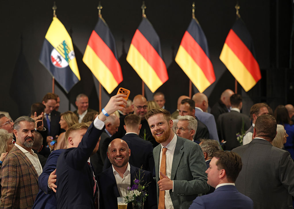 AfD supporters at an election watch party Magdeburg, Germany, do a selfie just before initial results showed the party with 44 percent of the vote in Saxony-Anhalt state elections on September 6, 2026.