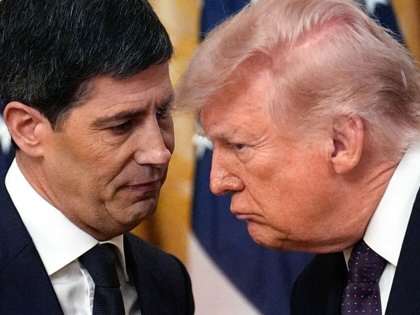 Donald Trump speaks with Kevin Warsh at the White House.