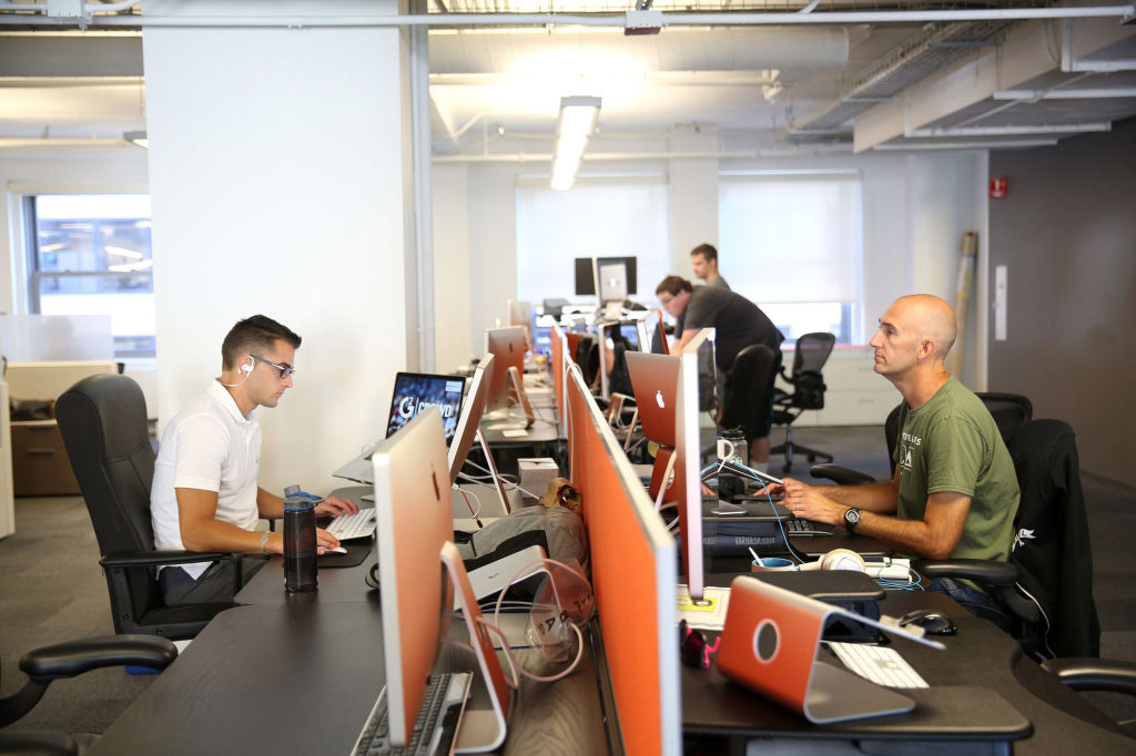 Employees work at G2 Crowd, a peer-to-peer software review company, in Chicago on Sept. 12, 2016.