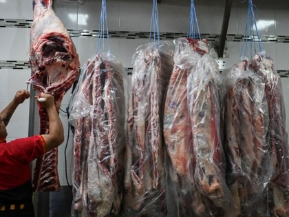 A worker cuts beef at the H&H meatpacking plant in Buenos Aires, Argentina, on December 5, 2025.