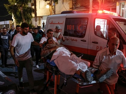 A paramedic transports an injured Palestinian into the Ramallah Governmental Hospital after arriving from the village of Al-Mughayyir, northeast of Ramallah in the Israeli-occupied West Bank, following an attack allegedly carried out by Israeli settlers on August 30, 2026.