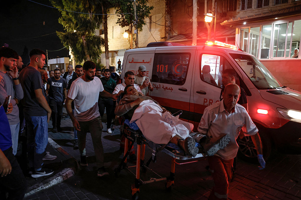 A paramedic transports an injured Palestinian into the Ramallah Governmental Hospital after arriving from the village of Al-Mughayyir, northeast of Ramallah in the Israeli-occupied West Bank, following an attack allegedly carried out by Israeli settlers on August 30, 2026.