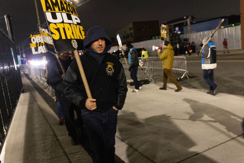 Amazon workers organized by the Teamsters union go on strike and walk a picket line in front of the DBK4 Amazon facility on December 20, 2024, in the Maspeth neighborhood in the Queens borough of New York City.