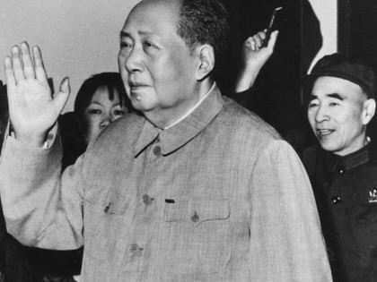 An elder Mao Zedong waves to a crowd, followed by Lin Biao.