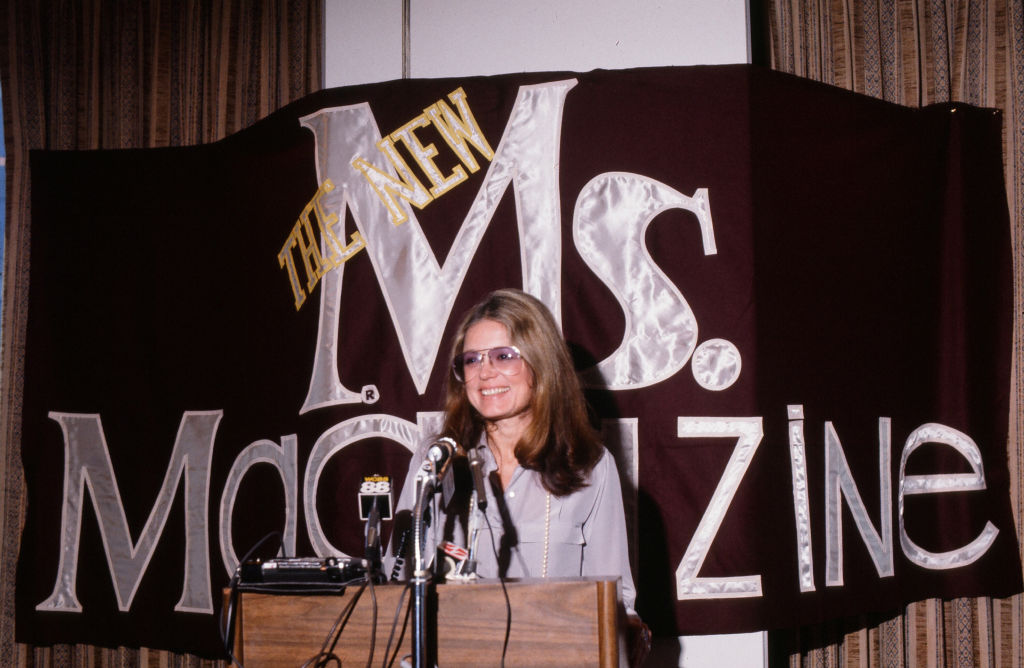 Gloria Steinem speaks from a podium at a press conference about Ms. magazine in the 1980s.