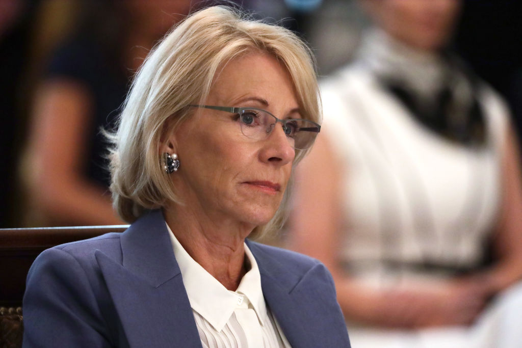 Former Secretary of Education Betsy DeVos listens during a cabinet meeting in the East Room of the White House on May 19, 2020, in Washington, DC.