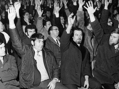 Striking workers at Ford Halewood factory in Liverpool make a vote with their hands during a meeting, April 1971.