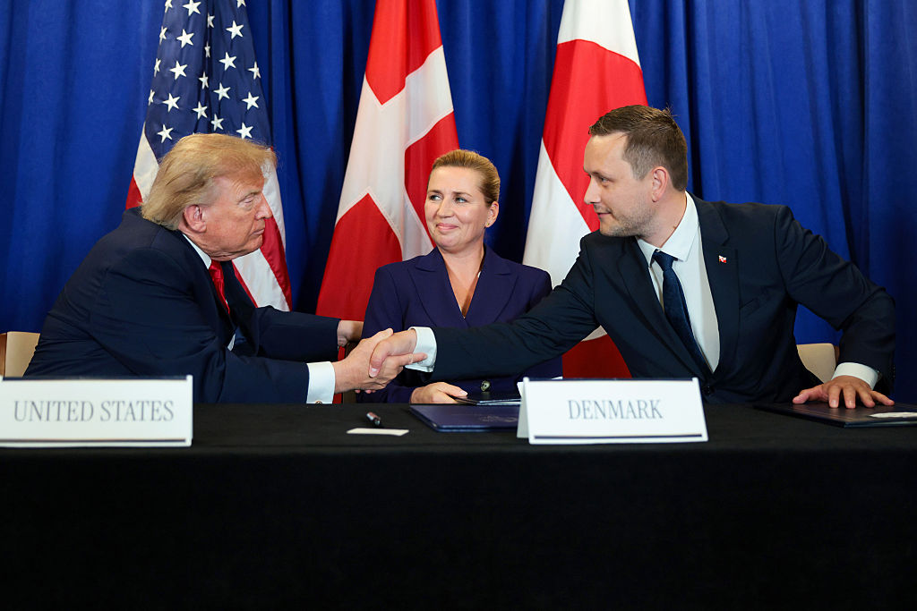 US President Donald Trump, Prime Minister of Denmark Mette Frederiksen, and Prime Minister of Greenland Jens-Frederik Nielsen shake hands during the signing of a security pact between the US, Denmark, and Greenland during the 81st session of the United Nations General Assembly at UN Headquarters on September 22, 2026, in New York City.