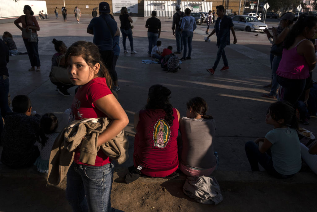 Asylum seekers gather at El Chaparral port of entry in Tijuana, Mexico, on August 10, 2018.