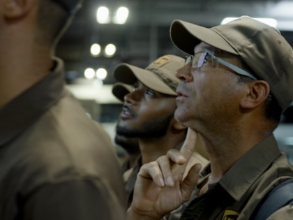 A still featuring three UPS workers from the 2026 documentary Who Moves America
